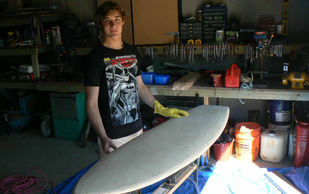 KEEN TO EXPERIMENT: Coen Wakeham-Hastie ready to glass his timber surfboard. INSET: Other boards Coen has shaped include an asymmetrical wonder (pictured right). KEEN TO EXPERIMENT: Coen Wakeham-Hastie ready to glass his timber surfboard. INSET: Other boards Coen has shaped include an asymmetrical wonder (pictured right).
